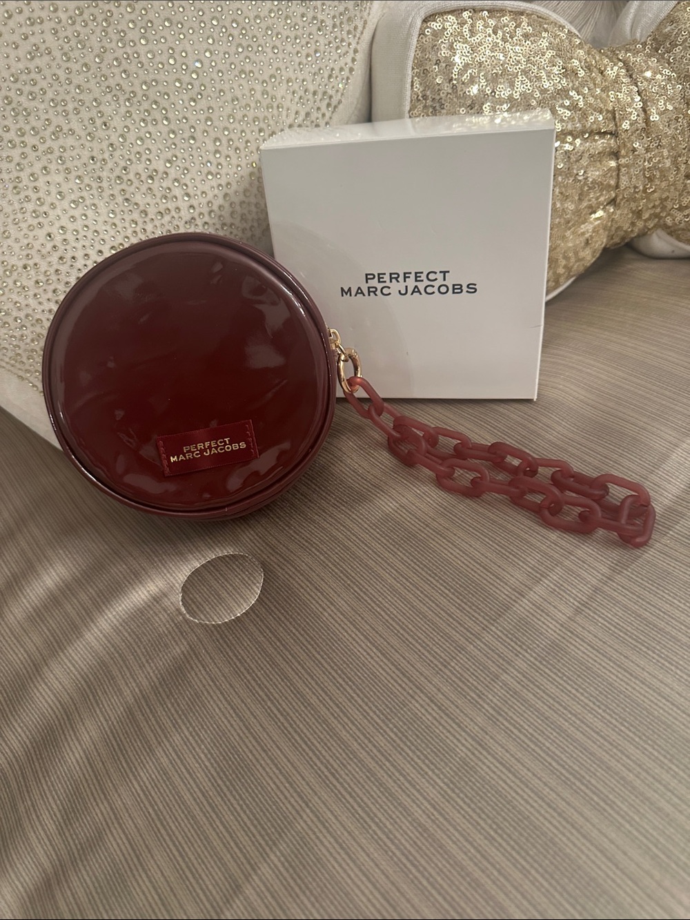 Marc Jacobs Glossy Round Wristlet in Burgundy